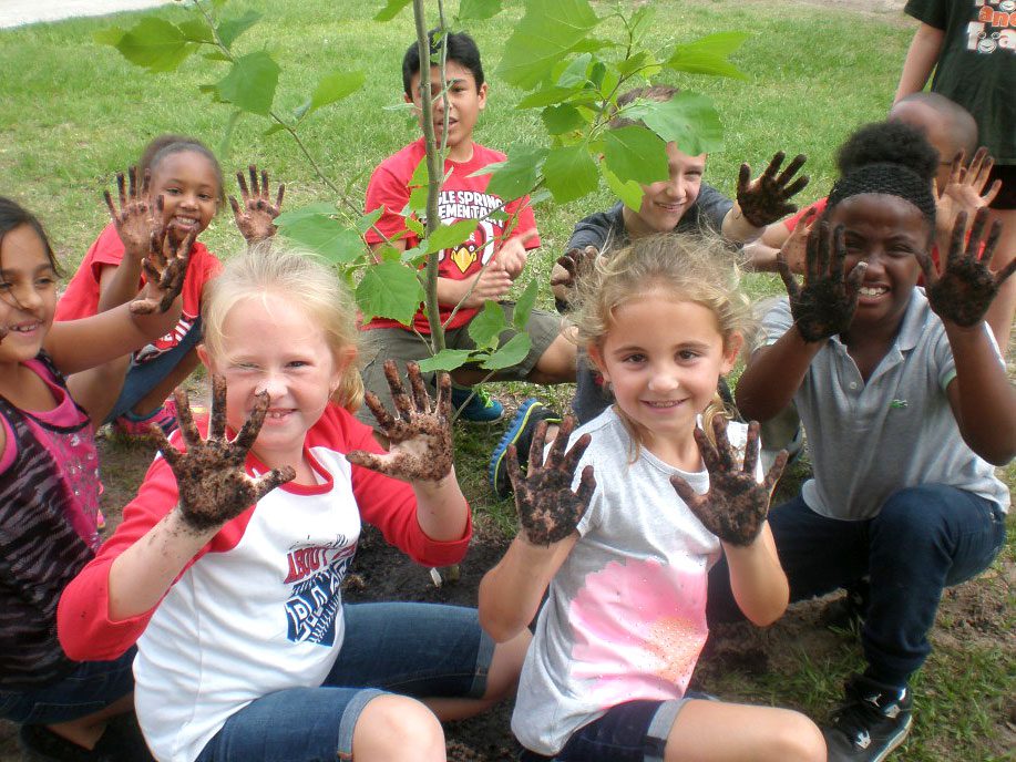 Birdsleuth children gardening, by Darcy Petzold.